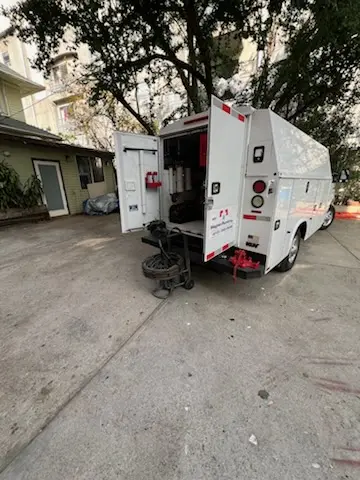 Magnet Plumbing service vehicle on-site for Water Heater Repair in Travis Heights